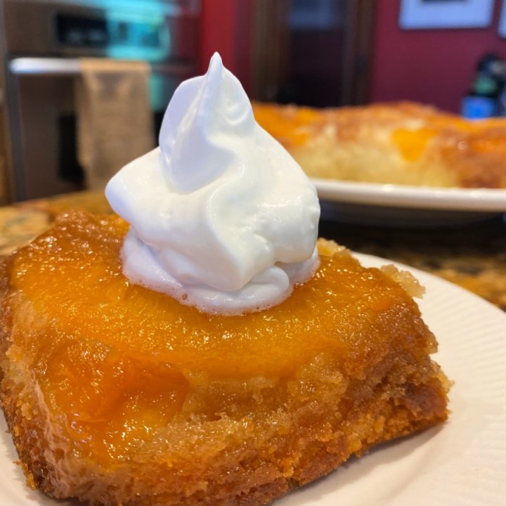 whipped topping on peach cake