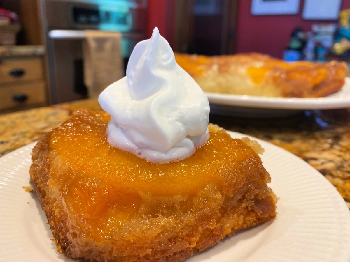 whipped topping on peach cake