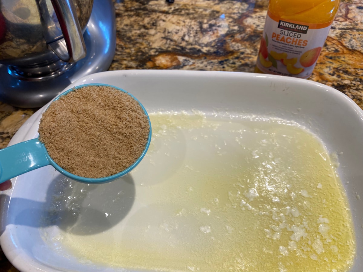Pouring brown sugar into melted butter