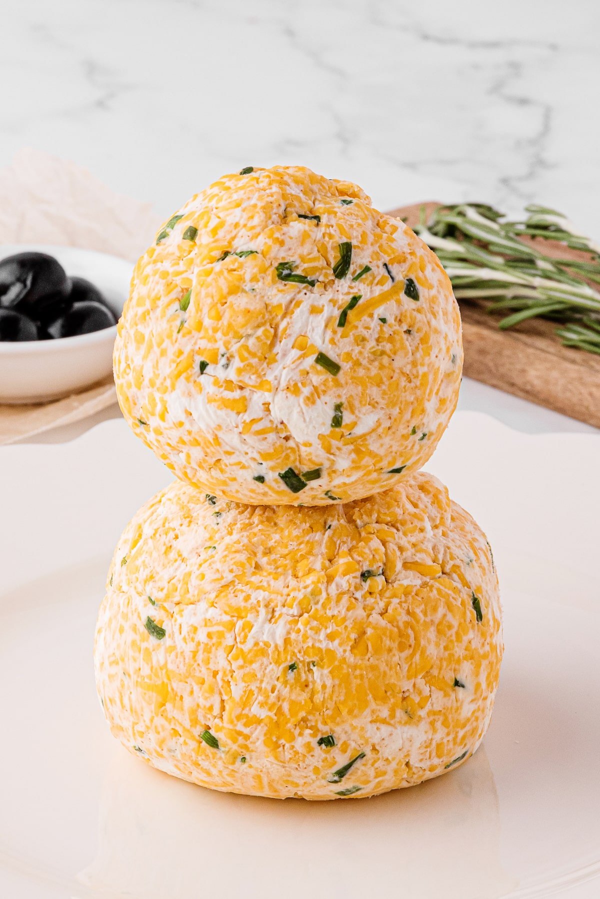 cheese balls stacked on a white countertop