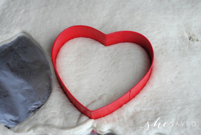 Use cookie cutters to make Heart shaped pizza dough