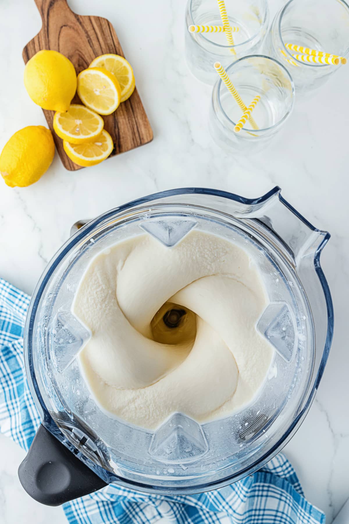 blending ice cream in a blender with lemons