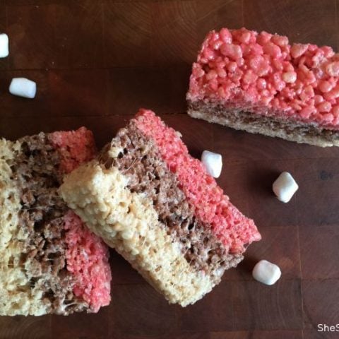A new twist on an old favorite! Make these fun Neapolitan Rice Krispie Treats, they are delicious!