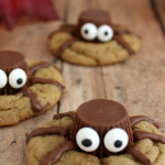 spider cookies made with peanut butter cups and candy eyes on top of a cookie