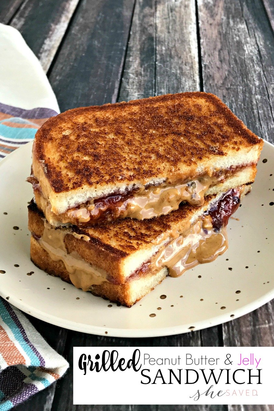 Grilled Peanut Butter and Jelly Sandwich on a plate with dripping peanut butter