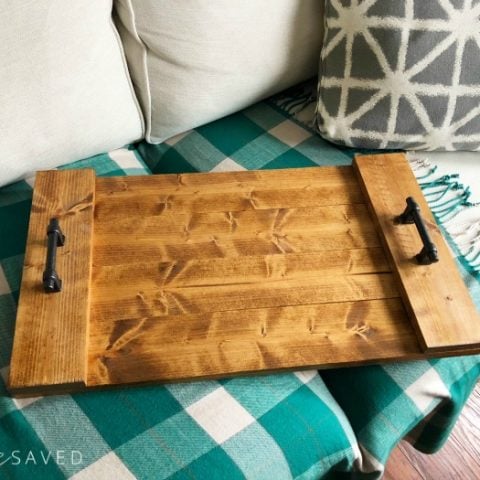 wooden serving tray sitting on a checkered table cloth
