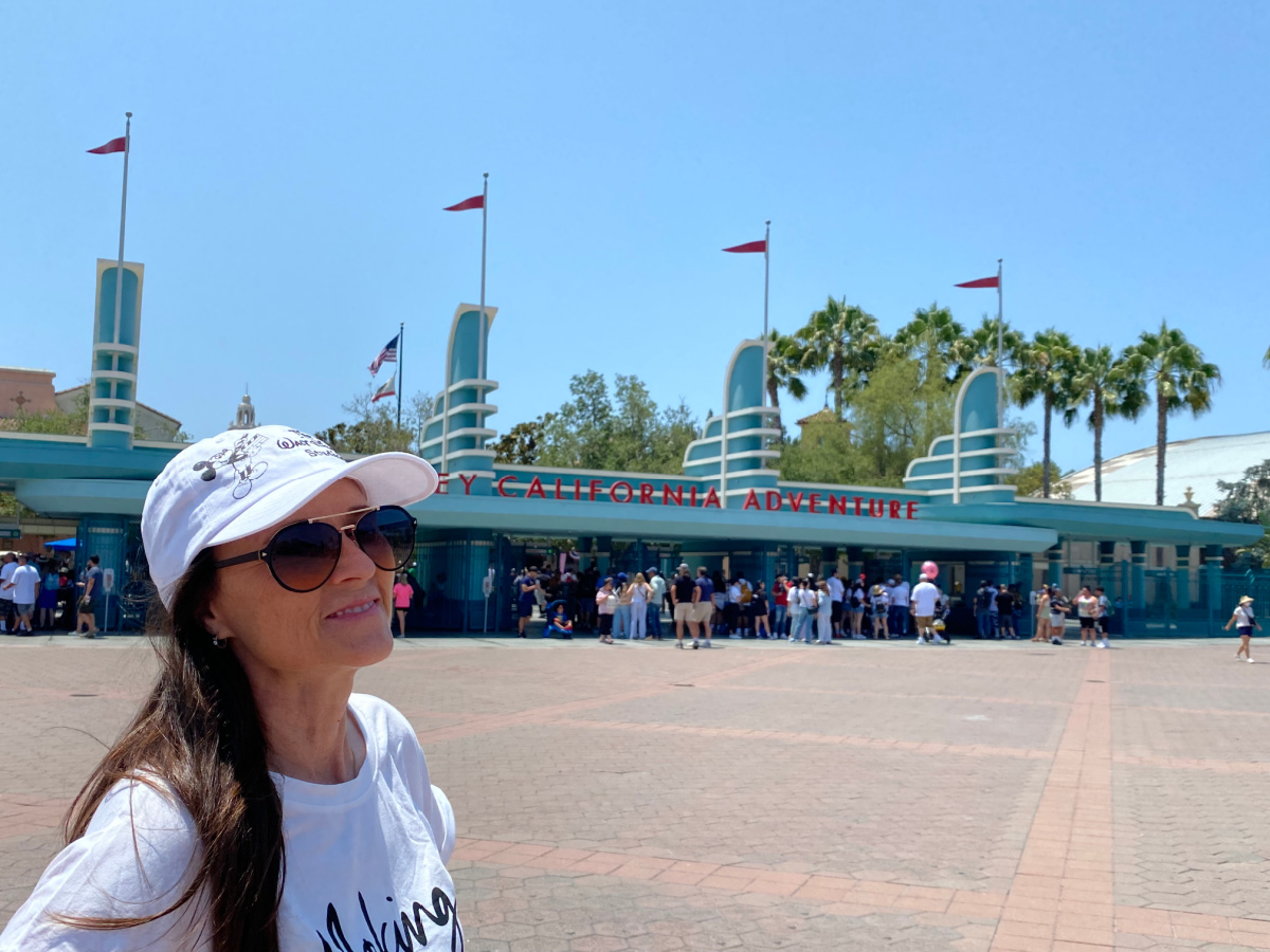 She Saved Best Day Ever Vacations ambassador smiling at the entrance of California Adventure at Disneyland