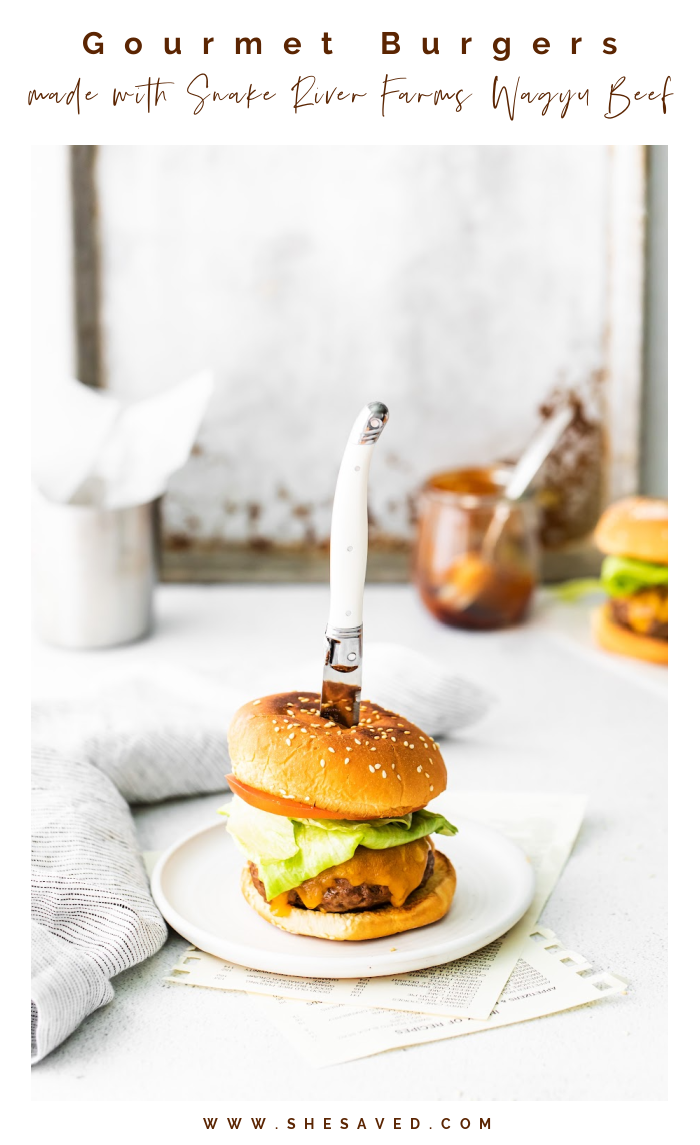 Waygu Beef Burger with knife through it 