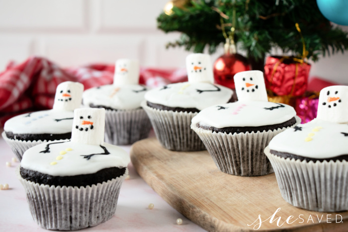 group of cupcakes with snowman on top