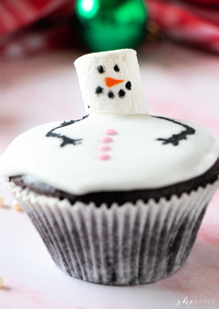 cupcake with marshmallow snowman head on top