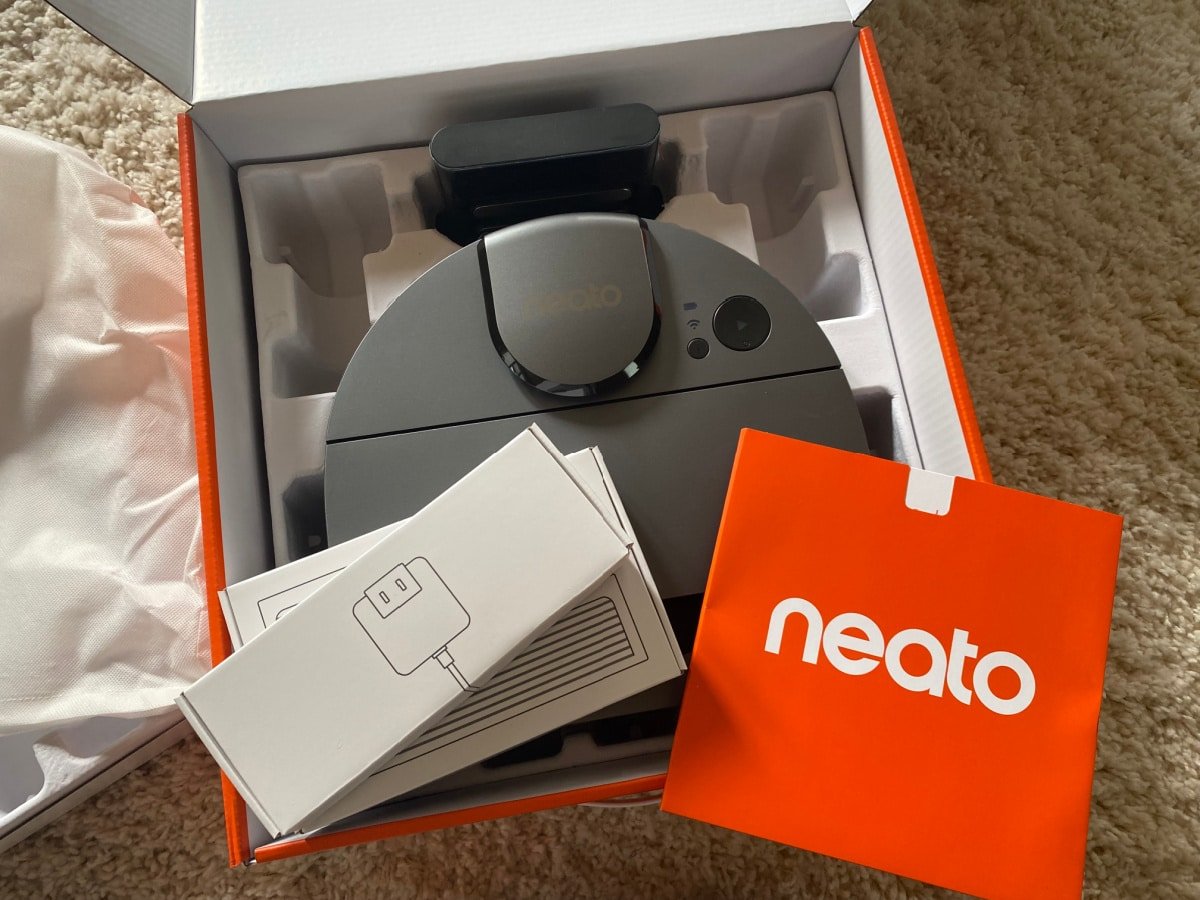 Neato D10 vacuum in box with chargers and manual