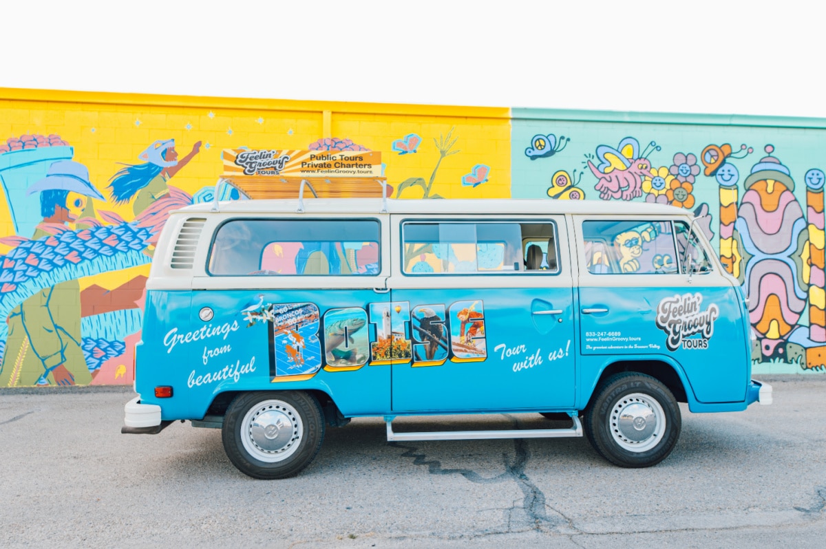 Blue Volkswagon bus with bright colored background