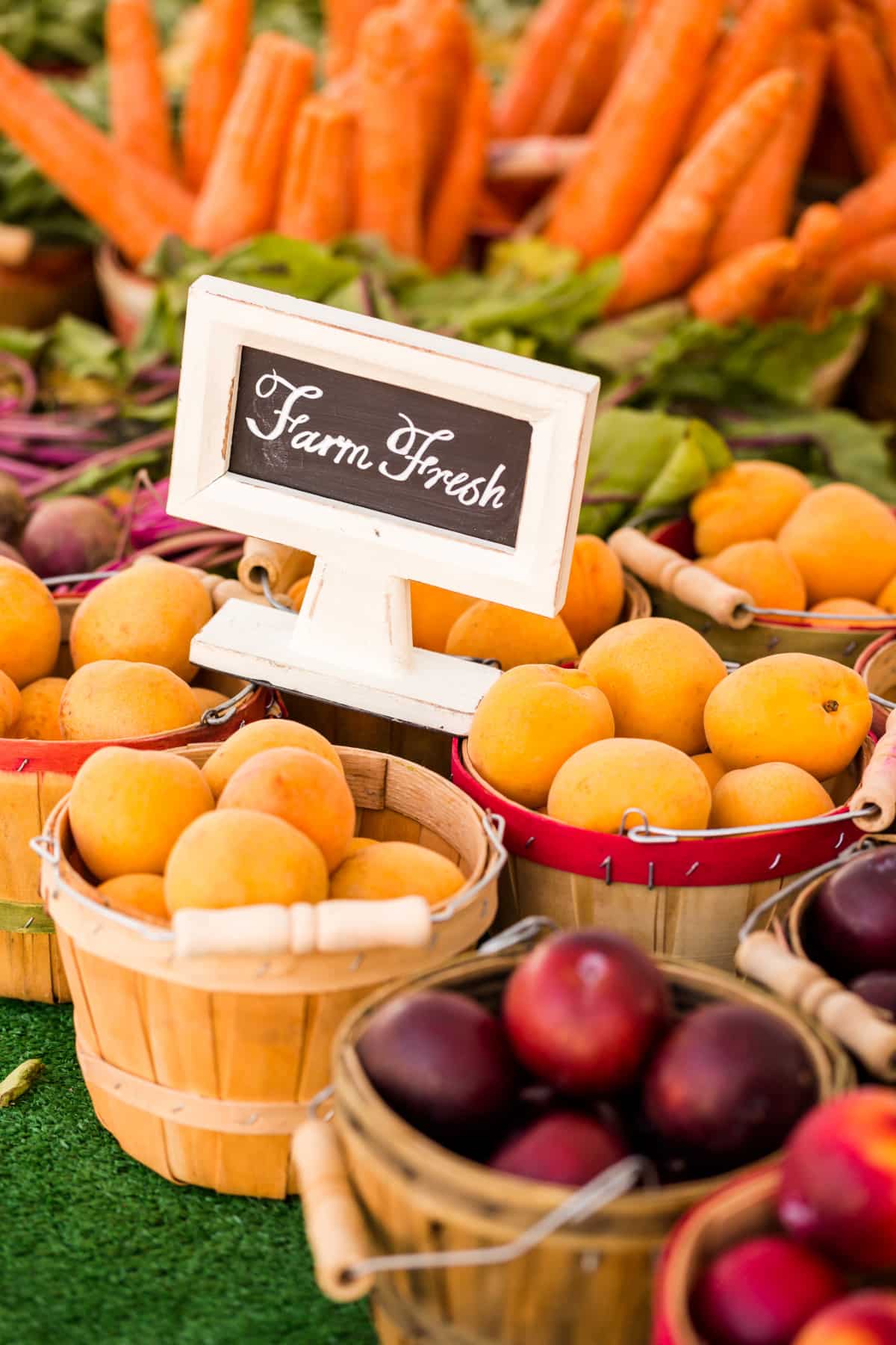 Apple creates of fresh organic produce on sale at the local farmers market.