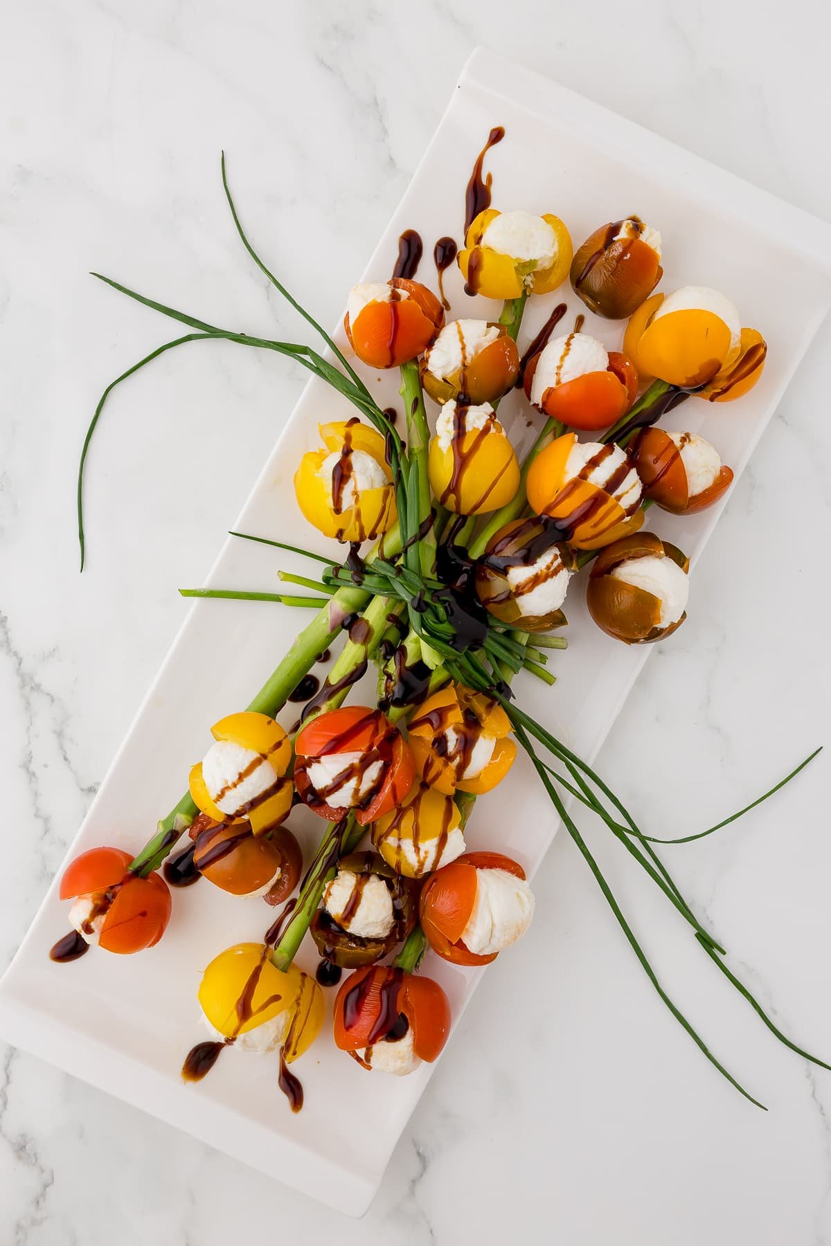 bundle of tomatoes that look like tulips with balsamic drizzle