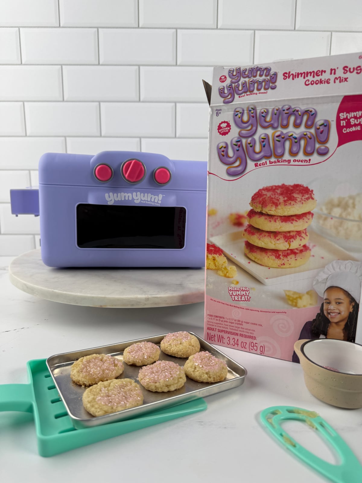 YumYum baking oven with cookies and box sitting on a counter